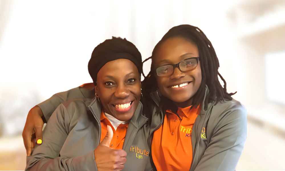 2 Tribute Caregivers Smiling wearing Tribute Home Care uniforms