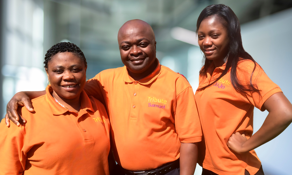 3 Tribute Caregivers Smiling wearing Tribute Home Care uniforms