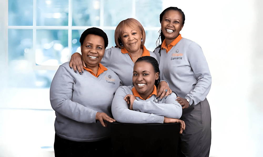 4 Tribute Caregivers smiling in Tribute Home Care uniforms