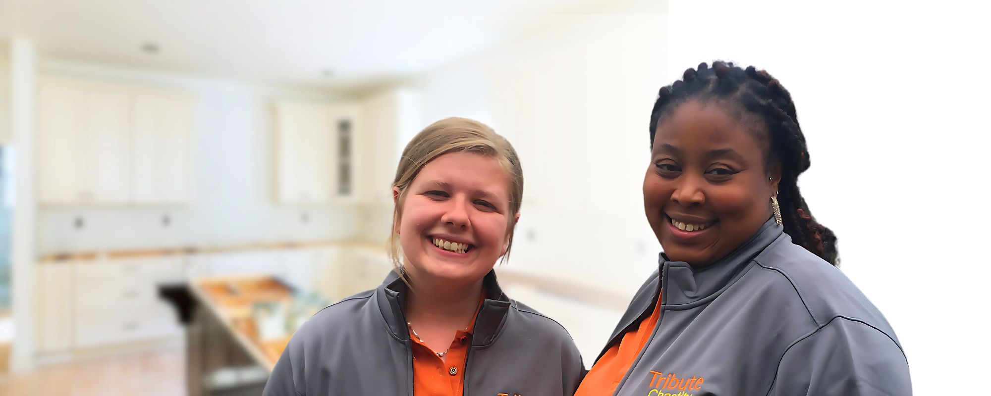 2 Tribute Caregivers smiling in Tribute Home Care uniforms