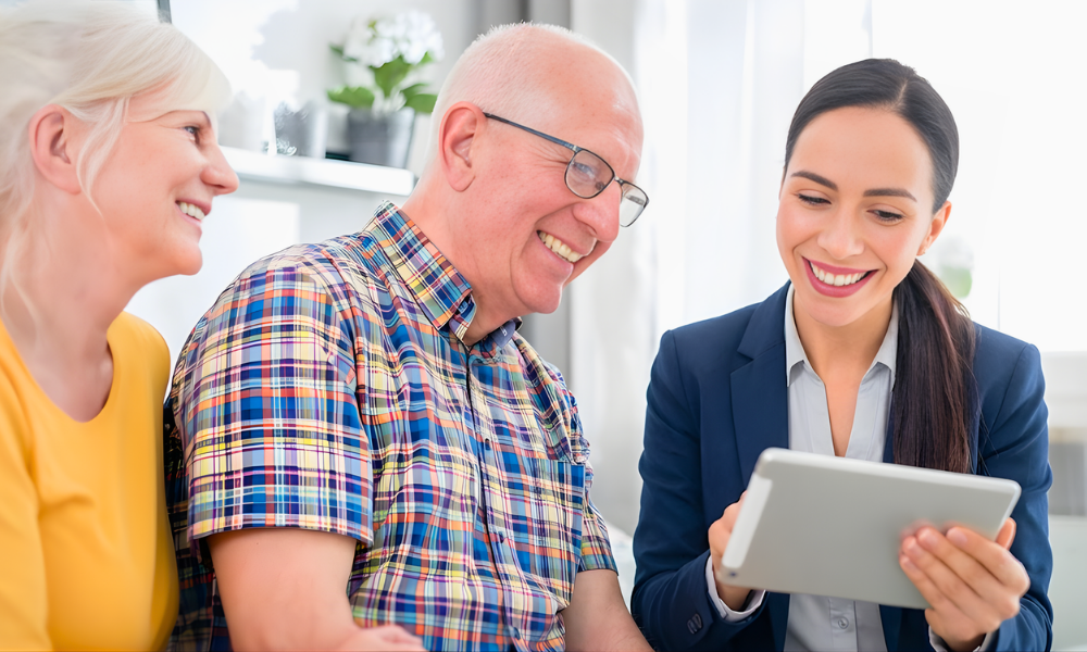 Home care professional assessing care needs with an older couple during an in-home consultation